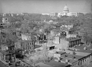 This David Moffat Myers photograph of Southwest DC was taken in 1939 prior to the clearance of the neighborhood.  The image, courtesy of the Library of Congress, is in the public domain.